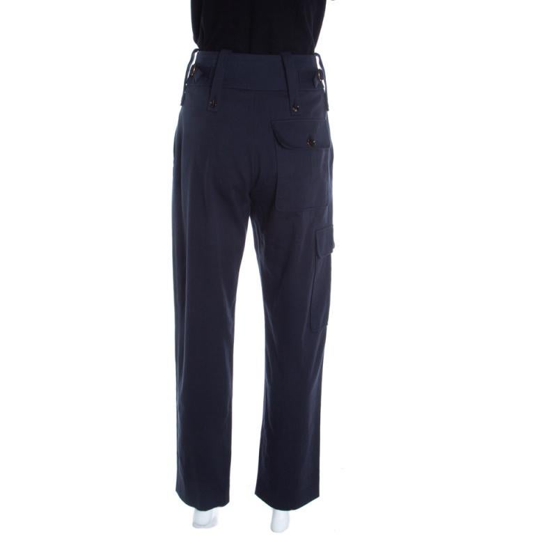 Update your casual closet with these deep navy blue pants from Chloe. They are cut from cotton featuring cargo pockets placed on one side and back. These have a fine structure with button fastenings on the waistband. They will look cool with a tee