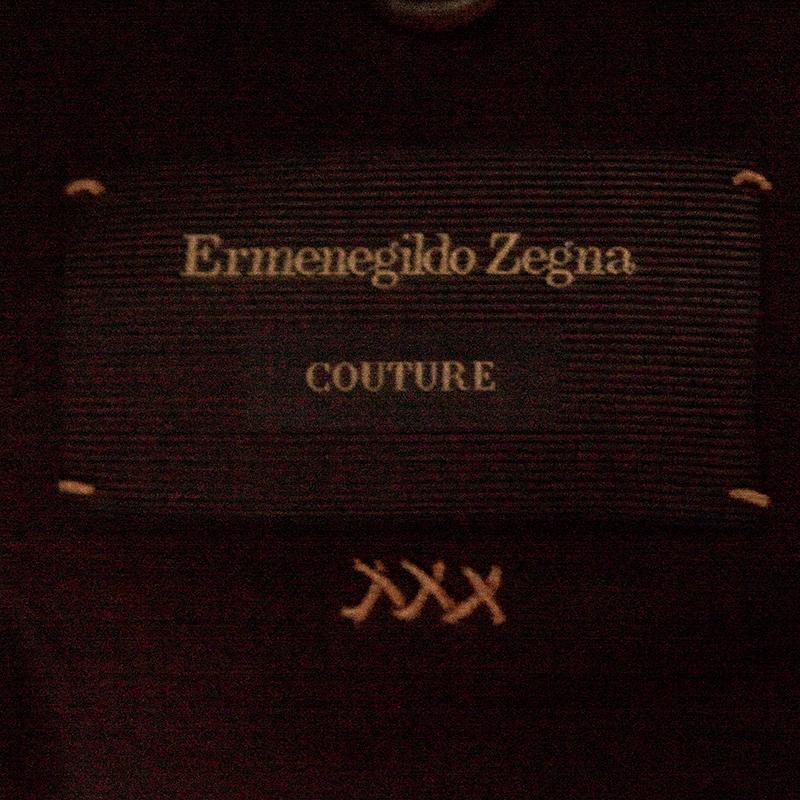 A classy piece to sport for your Monday presentations, this tailored blazer from Ermenegildo Zegna Couture is an upscale staple that your wardrobe needs. It is crafted with a cotton and silk blend and features a subdued brown hue. Exuding a textured