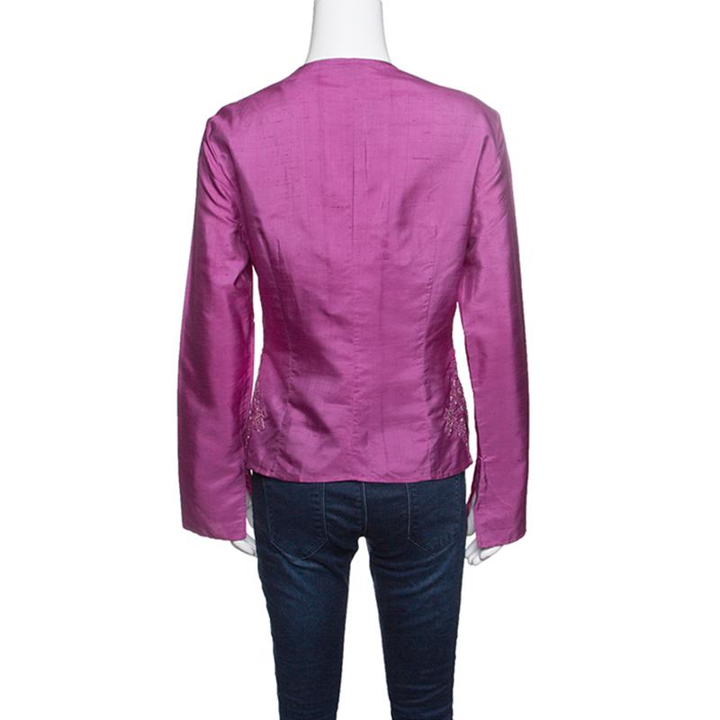 Ditch those boring tops and get your hands on this lovely creation from Emporio Armani. The silk top flaunts a plunging V-neckline, long sleeves adorned with bead embellishments. Complete with long sleeves, rock this top with pants and