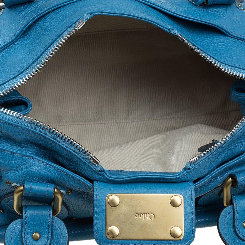 A favourite amongst celebrities, this Paddington Satchel rules the hearts of many young fashionistas. Composed of gorgeous blue leather, this bag features a slightly slouchy silhouette. It comes with dual rounded top handles and punctuated with
