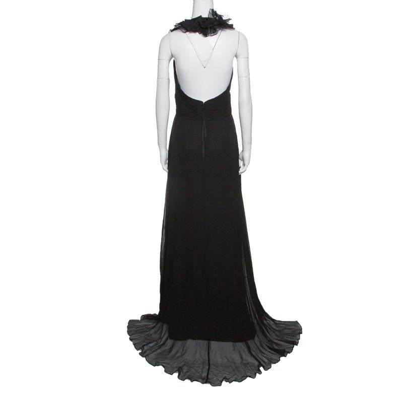 Elevate your party closet with this stunning black dress from Notte By Marchesa. It is crafted in a fabulous silhouette and is lifted by self-tie halterneck straps. The plunging neckline is adorned with chiffon ruffle details exuding a high-fashion