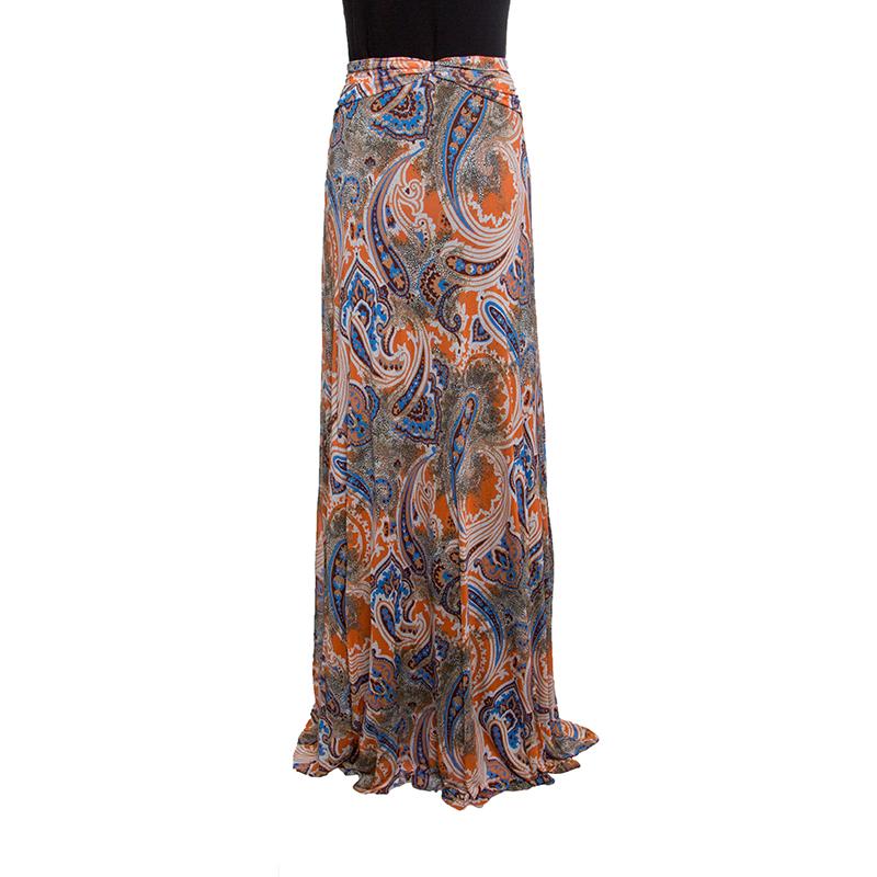 Gorgeous in details and high on appeal, this maxi skirt is from the house of Etro. It is made from quality fabrics and designed with drapes and colourful prints all over. This creation will look perfect with a plain top and flat slides or strappy