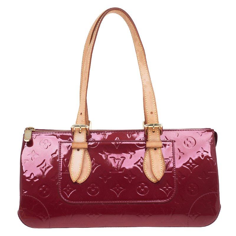 Expect to wear this sophisticated yet youthful Rosewood Avenue handbag by Louis Vuitton for years to come. Crafted from iconic red monogram embossed Vernis patent leather with adjustable tan leather shoulder straps, its classic shaped exterior is