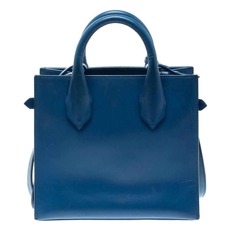 A perfect summer bag to pair with almost any day time casual and casual chic looks, this Balenciaga Mini All Afternoon tote bag is sure to replace your everyday bag. Crafted in blue leather, this bag adds a beautiful bright pop of colour along with