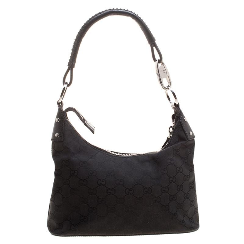 The stylish Gucci bags are made from supreme quality materials that can withstand years of use. Set the mood for the day with this brilliantly dazzling black bag. This bag is crafted from luxurious canvas in a structured silhouette.

Includes: The