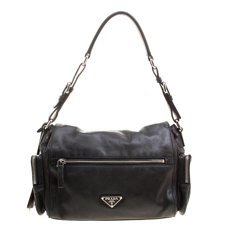 Enhance your casual wear with this wonderful handbag. Take it for your weekend break or carry for that neat look. Or you can match this chic black bag with your evening attire for a more dressy look. This incomparable trendy hand bag from Prada will