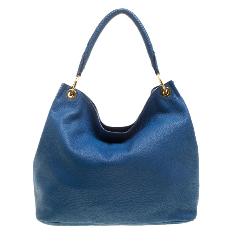 Classy and chic, this hobo is from Prada. It has been crafted from blue Vitello Daino leather and has the brand logo on the front. The stylish bag featuring a single handle has nylon-lined interior and is a worthy buy.

Includes: The Luxury Closet