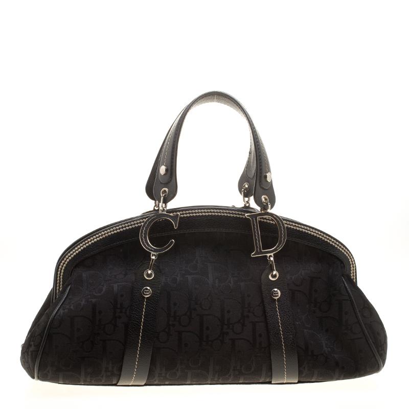 The nylon interior brings the balance and shape that is required to give class and durability. Carry this awesome canvas with leather trim handbag and get ready to conquer the world. Packed with features, this piece from Dior is an inarguable pick.