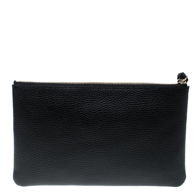 This sleek and stylish clutch from Gucci is crafted from black leather. It comes with stylish bamboo tassels and a canvas lined interior. The interior houses a slip pocket and is sized to hold your necessities.

Includes: Original Dustbag, Info