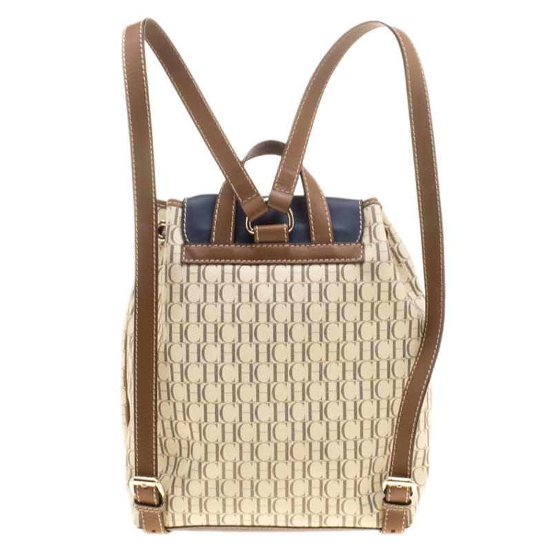This stylish backpack from Carolina Herrera is made from monogram coated canvas and has the gold-tone hardware. The bag features a beige hue, a drawstring top closure and a single buckle flap. It also has two pockets on the exterior and adjustable
