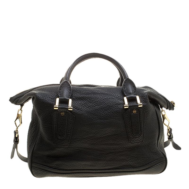Pair this black leather bag with a chic outfit for an impressive work-week look. The interior nylon is well-sized for your essentials and two handles are provided for you to carry it. Ideal for everyday use, this Burberry piece will never fail