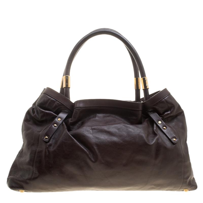 This well-made leather tote from Chloe combines sophistication to turn up your fashion game. The brown looks eye-catching to pair with multiple outfits. It has two handles and a fabric-lined interior, splendid for your essentials.

Includes: The