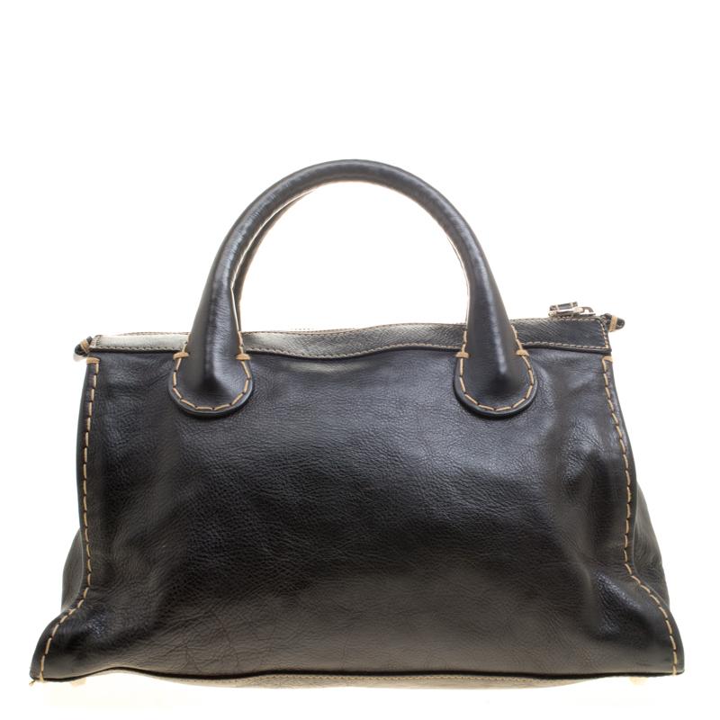 Featuring top handles and an exterior made of leather, this Chloe satchel exudes just the right amount of sophistication. The bag features an elegant structure and comes with a capacious interior and a front pocket.

Includes: Original Dustbag

