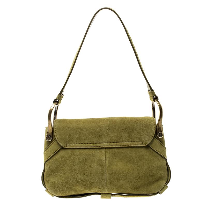 Flaunt a fab style with this gorgeous suede shoulder bag. It features a standard satin lined interior and a single handle. Modest yet chic, the green adds to its appeal. This one from Saint Laurent Paris is an incomparably exquisite