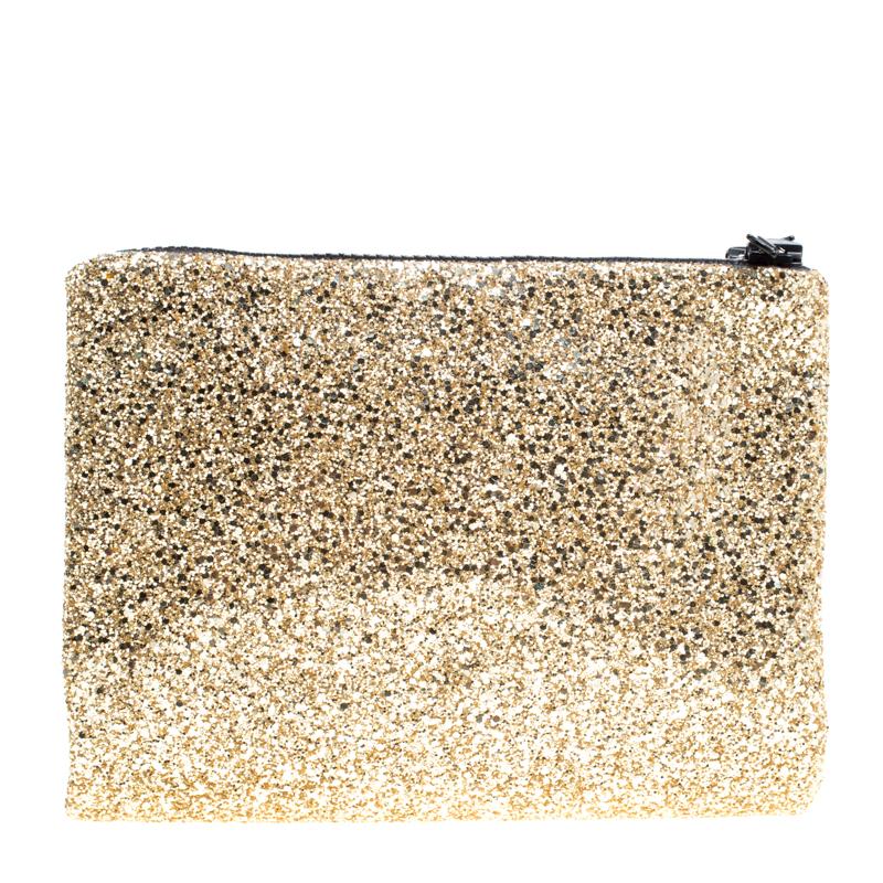 Complete your party look with this clutch from Mawi. Fashioned in silver glitter on the front and gold glitter at the back, the clutch is decorated with crystals and acrylic perspex embellishments on the front, which adds a glamorous finish to this