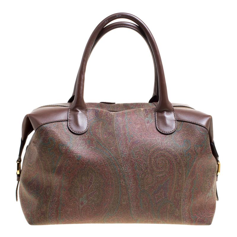 Meticulously crafted from paisley-printed canvas, this Etro bag exudes just the right amount of style and luxury. The bag features more paisley embroidered on it, a spacious fabric interior and two handles. Carry this stunner wherever you go and