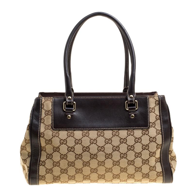 Stay organized in style with this Trophy Tote from Gucci. Crafted from signature GG canvas the bag features dual leather handles and a flower detailing with classic interlocking GG logo on the front. The fabric lined interior will hold all your