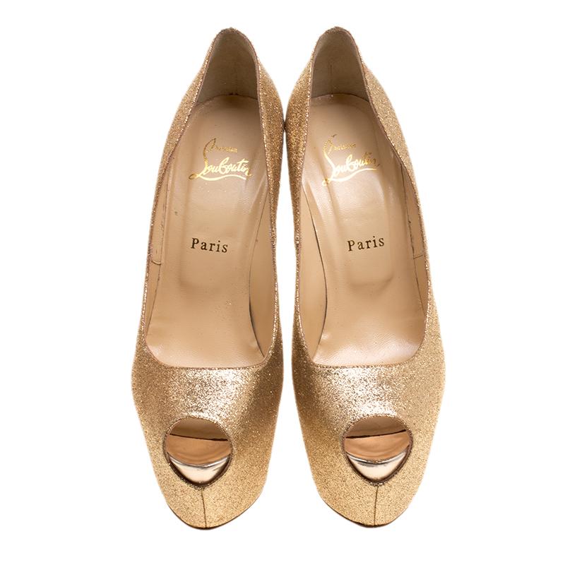 Make heads turn with this gorgeous pair of Louboutins that exude high fashion. Crafted from gold glitter, this is a piece from their Lady Peep collection. Peep toe in style they come with the signature red sole, leather lined insoles and stiletto