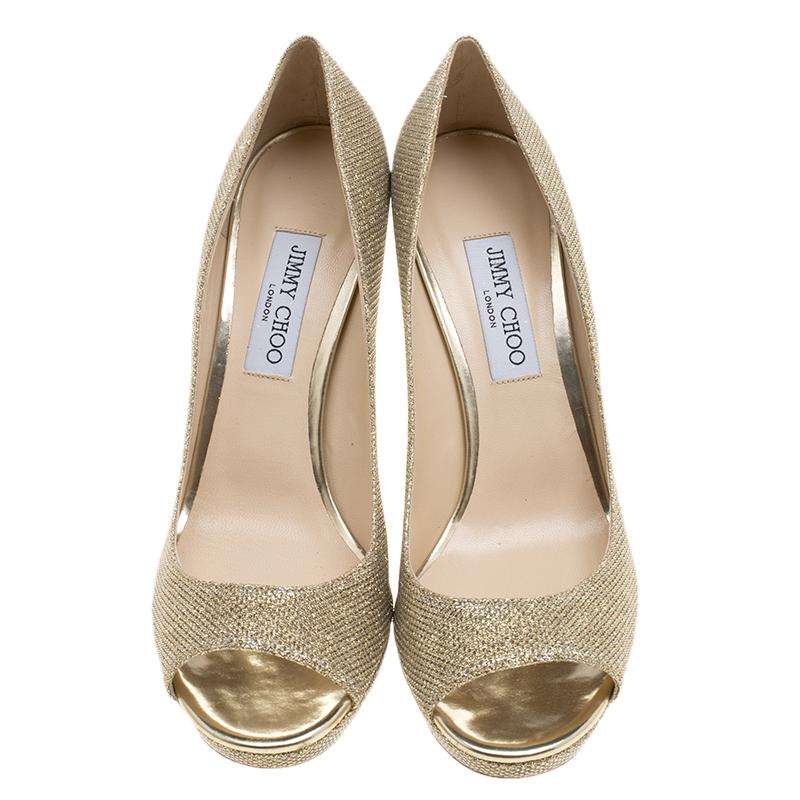 Add this brilliant pair of Jimmy Choo pumps to your wardrobe and mix and match with accessories to create multiple looks. Covered in metallic gold, they are made from Lamè glitter fabric and lined with leather on the insoles. They sport peep toes,