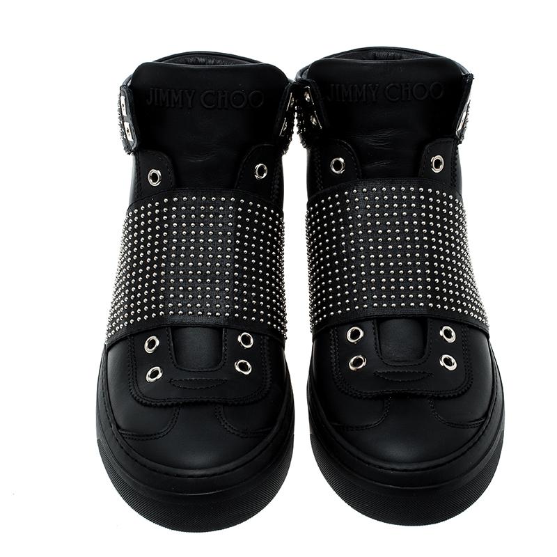 These Jimmy Choo sneakers are trendy and stylish. Richly crafted from leather, they feature a high top design with eyelets and studs on the elastic trims and collars. The sneakers also carry the brand's label on the heels. You are sure to make a