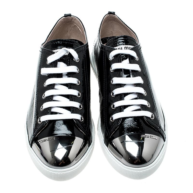 Step out this weekend in these stunning sneakers from the house of Miu Miu. Crafted in a black patent leather body, these sneakers come with a metal cap toe and completed with lace-ups. This lightweight pair is set on a comfortable platform sole