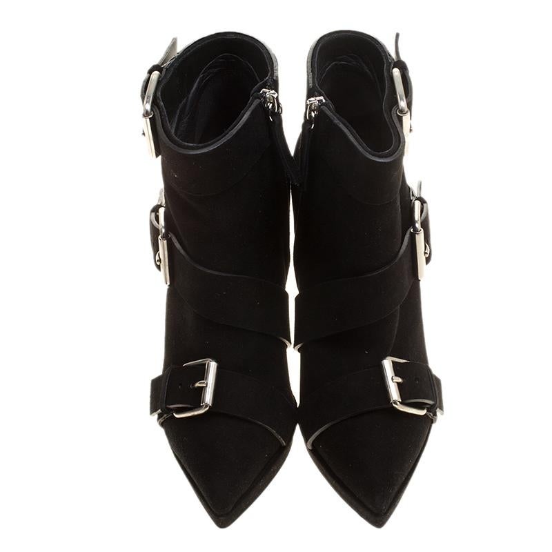 No fashion quest is complete without a pair of boots that stands out uniquely from one's closet. Like these Giuseppe Zanotti ankle boots that come crafted from suede and designed with a mix of luxury, style and edginess. They feature buckles, 13 cm