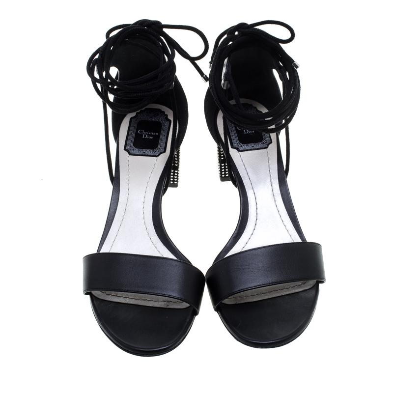 A perfect mix of elegant fashion and sensuous style, these Dior sandals come crafted from leather and detailed with lace-ups that end as a self-tie at the ankles and studded block heels. They're visually stunning and fashionable.

