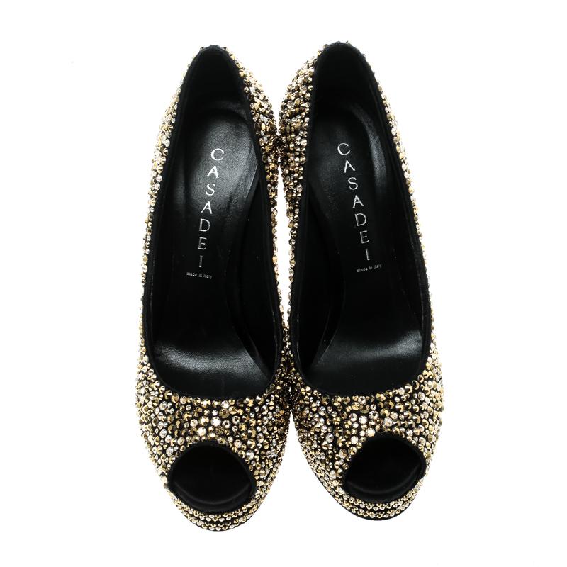 Finesse and poise will all come naturally to you when you step out in this pair of pumps from Casadei. Beautifully embellished with Swarovski crystals, the peep toe pumps are truly breathtaking. They are complete with leather insoles, 14.5 cm heels