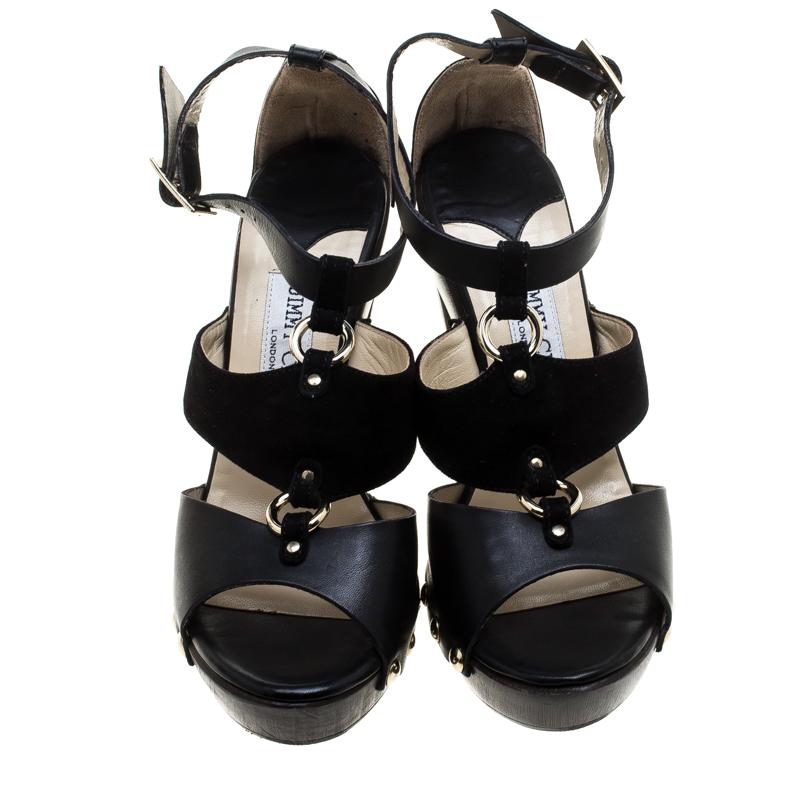 Beautifully designed and lovely to look at, this pair of sandals by Jimmy Choo is a keeper. They carry a design of black straps of suede and leather, ankle fastenings, studs and 11 cm heels supported by platforms.

Includes: The Luxury Closet