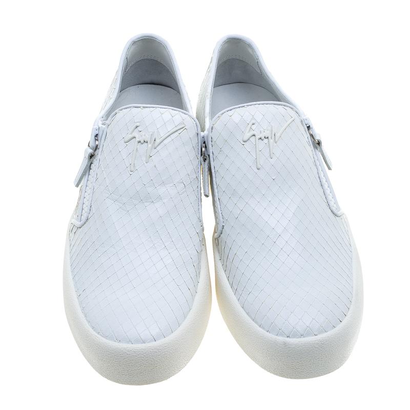 To accompany your attires with ease, Giuseppe Zanotti brings you this pair of sneakers that speak nothing but high style. They've been crafted from textured leather and detailed with zippers. The comfortable sneakers are easy to slip on and they are