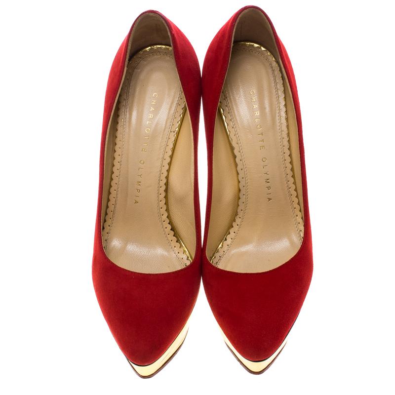 You are sure to impress everyone whenever you step out in these pumps from Charlotte Olympia! Crafted out of suede in an enticing red shade and lined with leather on the insoles, this number is from their Dolly collection. They've been beautified