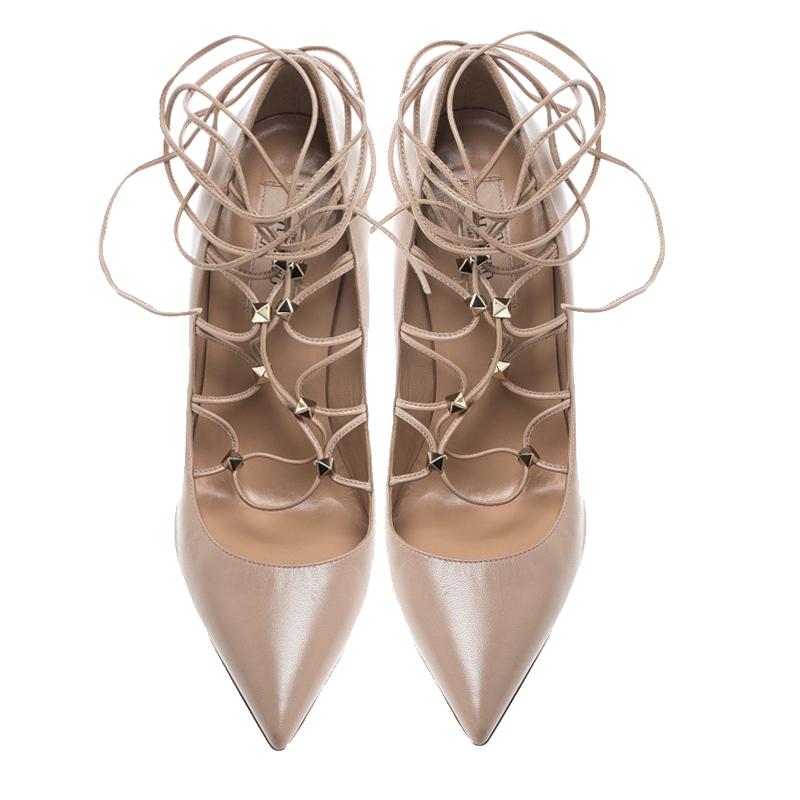 Designed with leather into pointed toes and laces-ups with pyramid studs, these pumps from Valentino can be worn with skinny jeans and dresses too. Leather insoles and 11 cm heels make the pair ready to be yours.

Includes: The Luxury Closet
