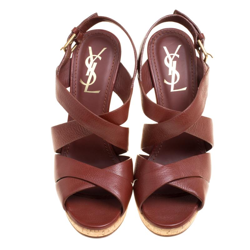 We can't stop gushing over this amazing pair of sandals from Saint Laurent. They have been crafted from leather and styled in a strappy layout. The sandals come with buckle fastenings and wedges.

Includes: Original Dustbag

