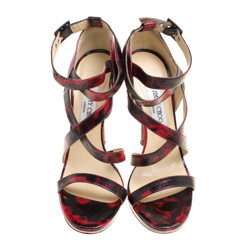 Strut your way in style and dazzle the crowds with these fabulous sandals from Jimmy Choo. These beauties are crafted from leather and feature an open toe silhouette along with criss cross ankle straps. They come equipped with gunmetal buckles,