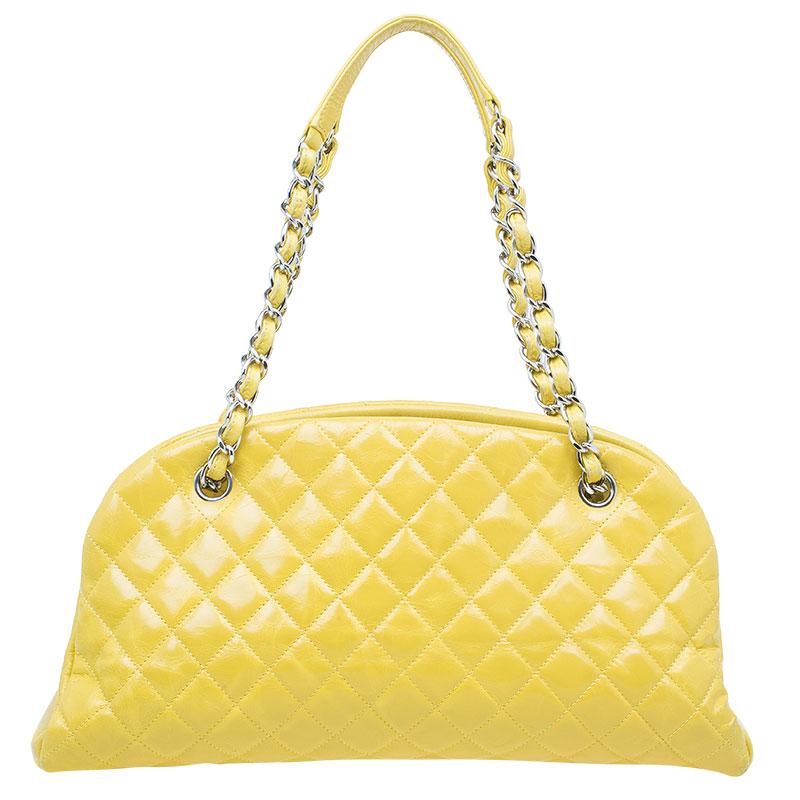 Debuting as part of Chanel’s 2011 Cruise Collection, this elegantly shaped Just Mademoiselle bowling bag is crafted from quilted yellow leather and features double chain-link shoulder straps and a ‘CC’ logo charm in silver-tone. The fabric lined