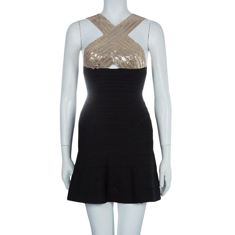 This beautiful Herve Leger dress is all you need for your ladies night out. Cut from rayon blend fabric, this black dress accentuates one's silhouette in the most admirable way. This Herve Leger dress features crossover strap shoulders with sequin