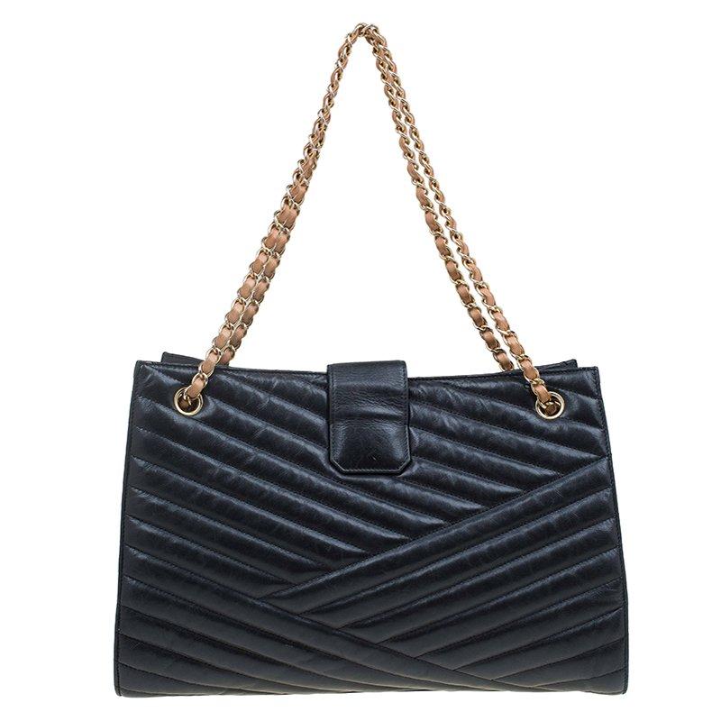 The classic chevron stitch will forever be a classic, and this Chanel bag exudes confidence and style. It features shoulder straps with intertwined leather and gold-tone chains. Lined with nylon, it features a turn lock closure that opens up to an