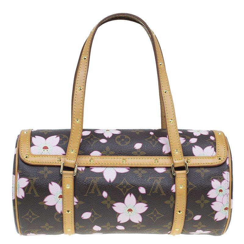Featuring beautiful printed cherry blossom all over, this limited edition and rare handbag designed by Takashi Murakami is a must-have for any Louis Vuitton enthusiast. The classic Papillon handbag gets a delightful update with smiley faced cherry