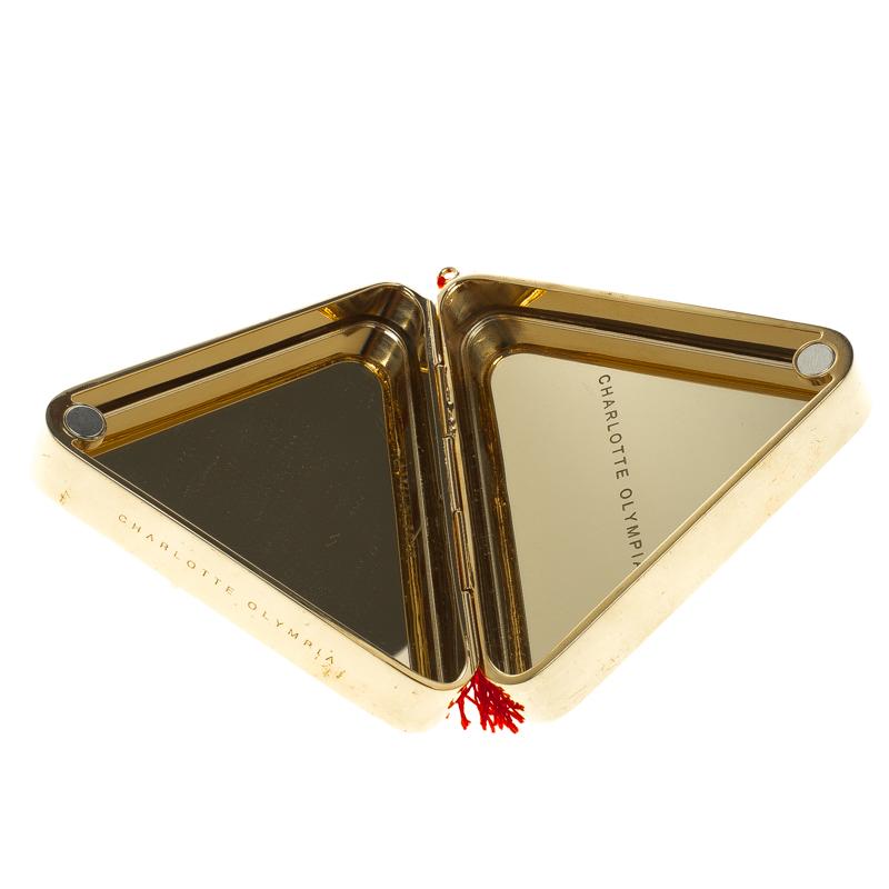 This quirky Nacho clutch from Charlotte Olympia will make you go gaga over its striking details. The gold metal clutch shines with its pretty embellishments at the front and a hanging tassel accent. Made in Italy, this clutch boasts of a mirror-like