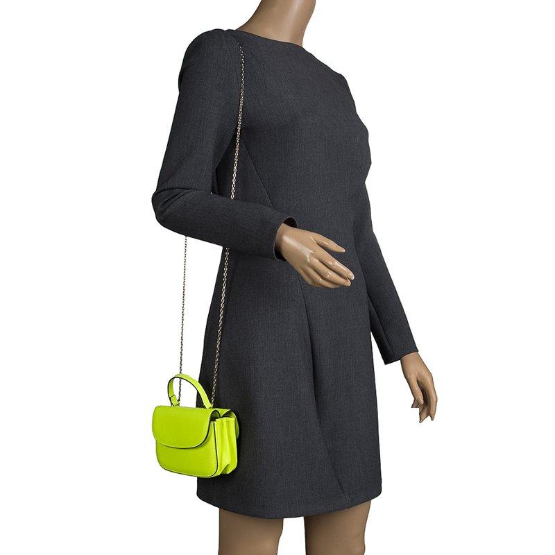 This trendy neon green crossbody bag from Valentino is love at first sight. It is crafted from leather and features gold-tone hardware in the form of the chain strap and the front brand label. With a rich satin lined interior, the bag is equipped