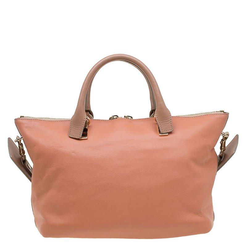 One of the many Chloe popular bags, the Baylee bag made its first appearance at 2013 Fall runway. It has a minimal design but with very interesting details. The smooth beige- peach pink leather exterior is paired with rolled contrast handles, a