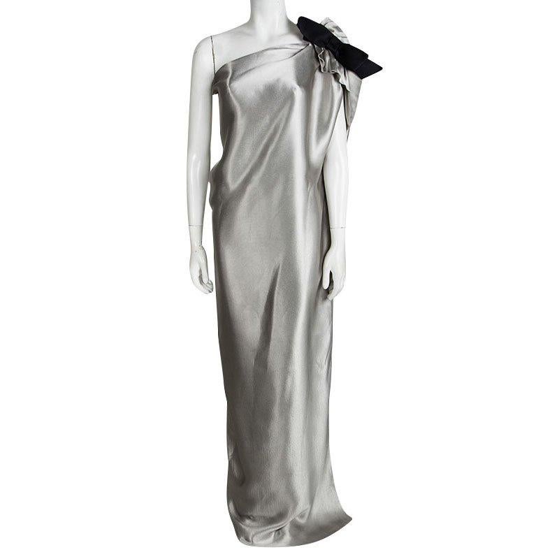This one shoulder maxi dress from Lanvin is to die for because of its stylish silhouette and design. The shimmering metallic silver dress is made of a silk blend and features a striking satin bow detailing on the shoulder. This maxi number can be