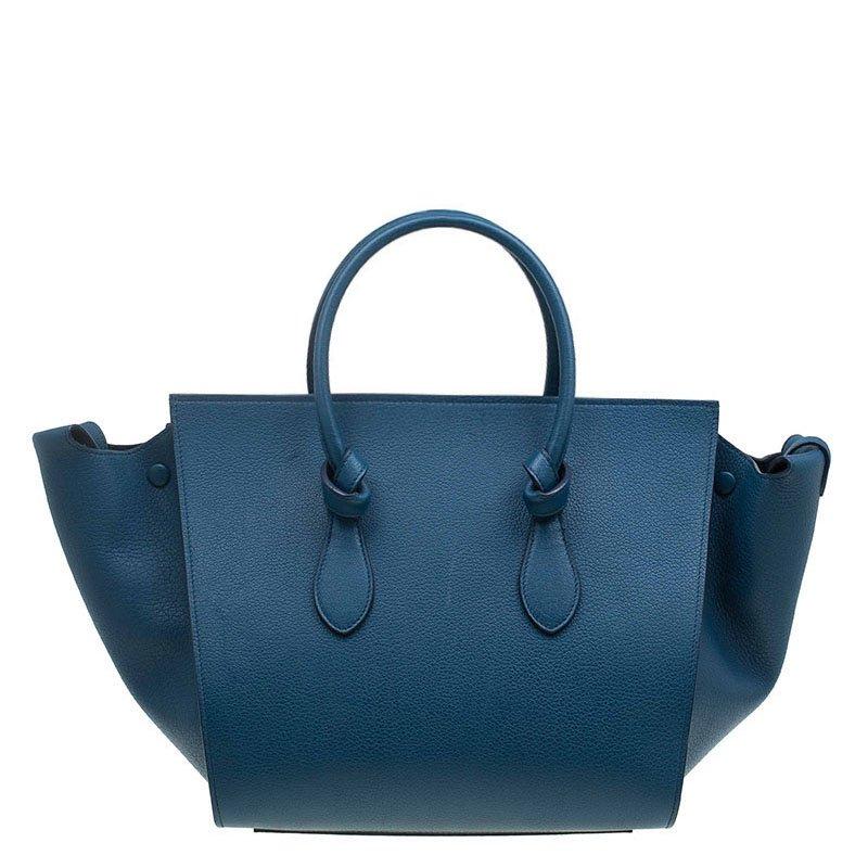 From Spring/Summer 2014 Collection, Celine Tie Knot Tote is an updated version of the Celine Phantom tote. Made from blue grainy calfskin leather, this boxy tote features 