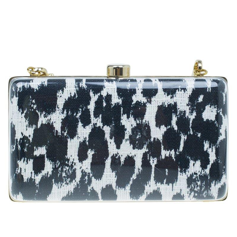 Fierce, funky, and eye-catching, this Felicity box clutch by Stella Mccartney is perfect for a fun night out. Crafted in PVC, it features a black and white design and is accentuated with gold-tone and is secured with a flip top closure. It opens to