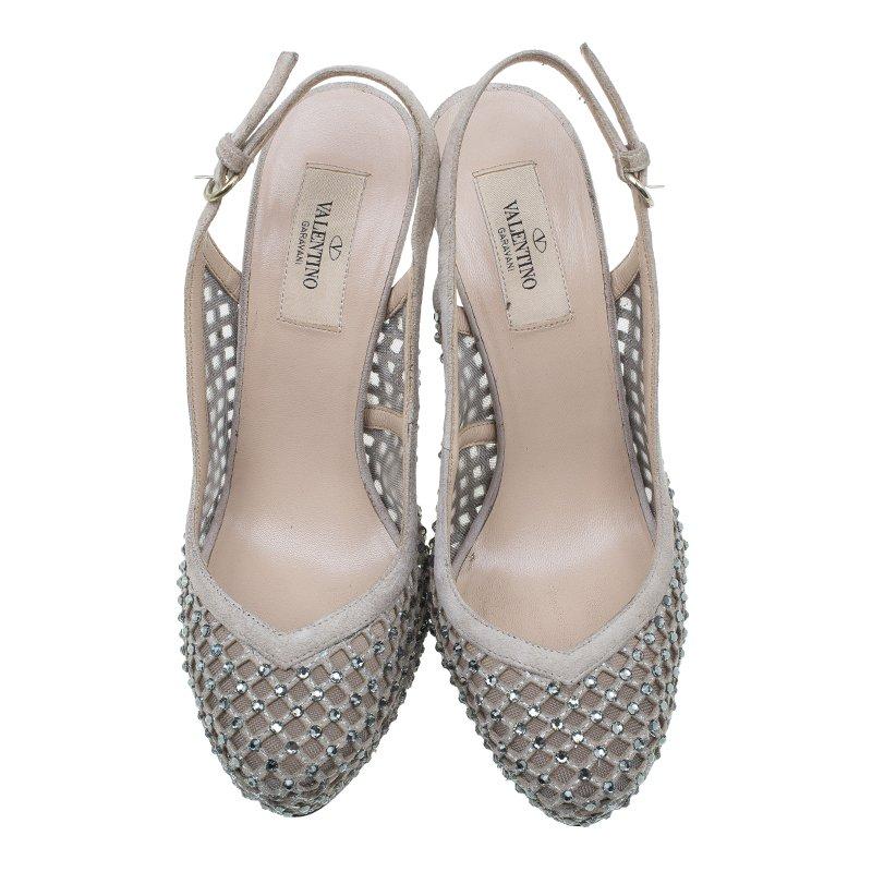 Dazzle with these Valentino Lattice Slingback Platform Sandals on any special occasion! They are crafted from mesh and suede and come in a diamond cut-out pattern. They are ornamented with lattice crystals that add the lustrous effect to the pair.