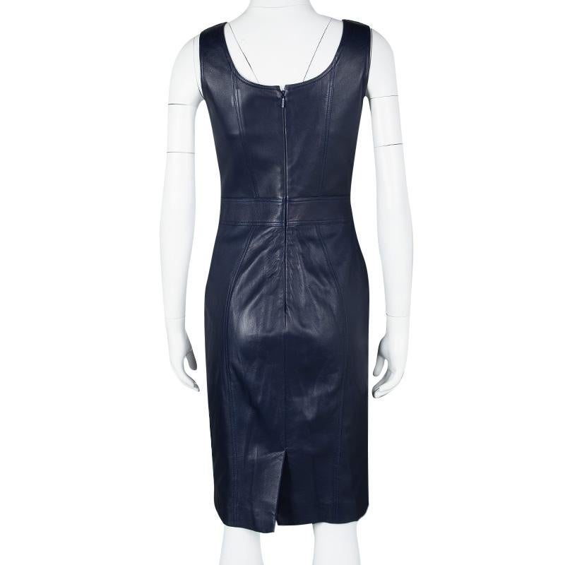 This navy blue dress from Versace has been made from leather and styled to glorify the fashionista in you. The dress features a scoop neck, a back zipper, and stud detailing. The sleeveless dress can be assembled with a pair of spike pumps from