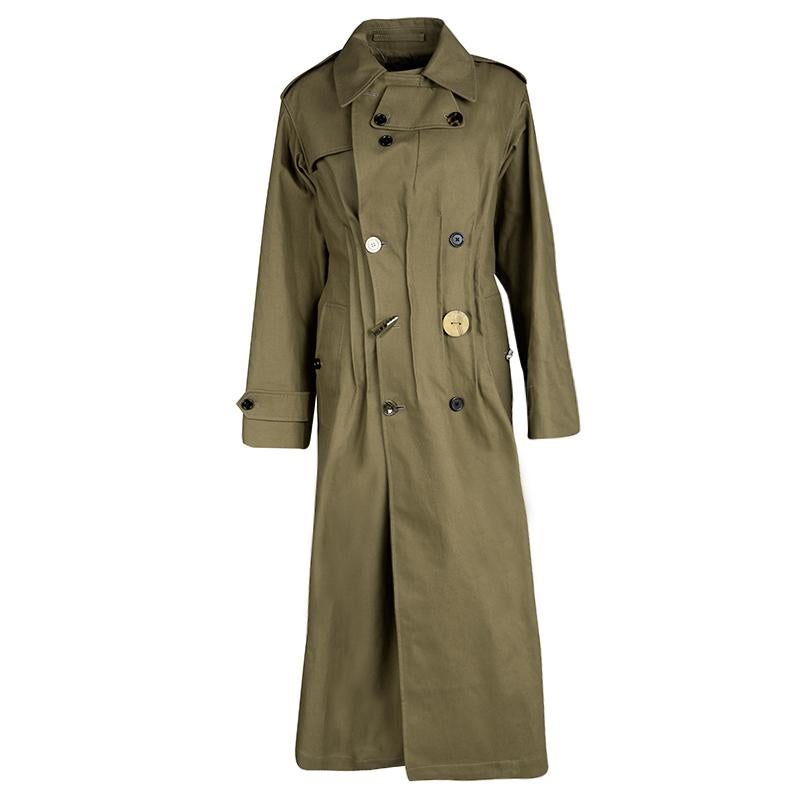 This double breasted trench coat is designed at Joseph's. It is made up of cotton, and features oversized notched lapels and an inverted pleat at the back to create subtle volume. Made in Italy, the coat features long sleeves, front welt pockets and