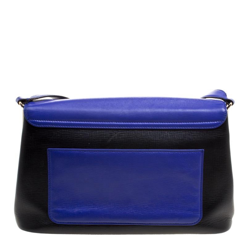 Shoulder bags as gorgeous as this one by Bvlgari are not creations you find every day. That's why this bag is worthy of a place in your closet. It has been crafted from leather and styled with an exterior that flaunts shades of black and blue. The