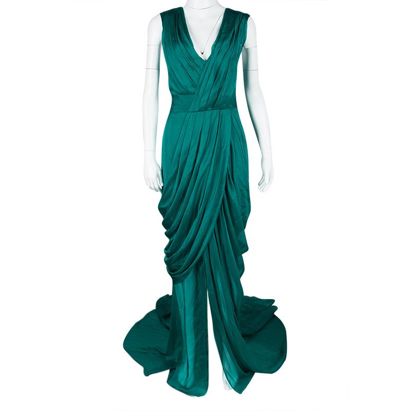 Leave everyone in awe whenever you step out in this gorgeous gown from Monique Lhuillier. Made from silk, the emerald gown has a dreamy silhouette with a V neckline, draped construction and a pick-up detailed train. You can assemble the complete