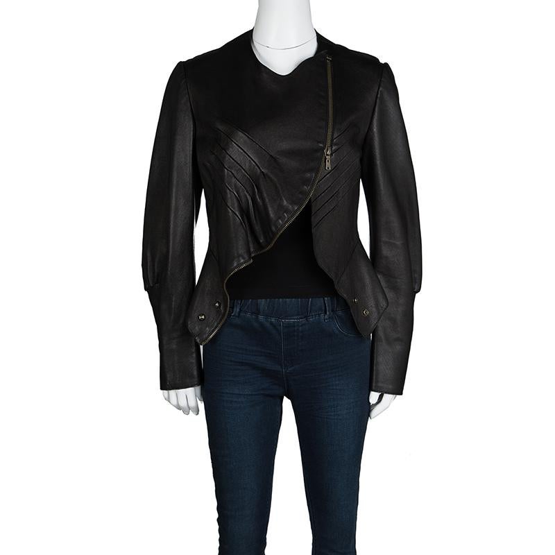 YSL’s leather jacket is such a rage! The Hiver’08 is cut from 100% genuine dark brown leather and has a flattering fit. Paneled front is embellished with gold-tone zipper front that runs along an asymmetric cut at the front. A peplum back adds to